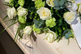 White flowers on coffin